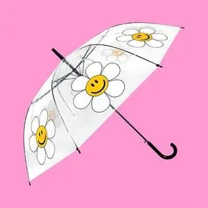 투명 돔형 우산. 데이지 꽃 안에 스마일 얼굴이 그려진 프린트가 들어간다